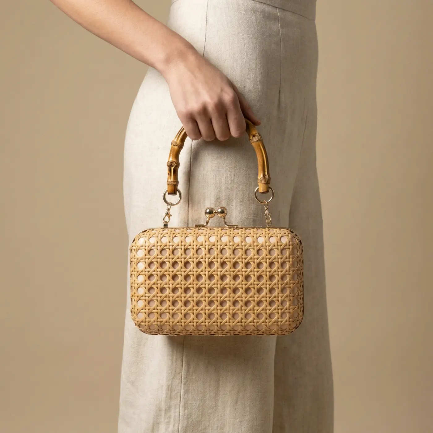Accessories lifestyle image: woven clutch marble counter