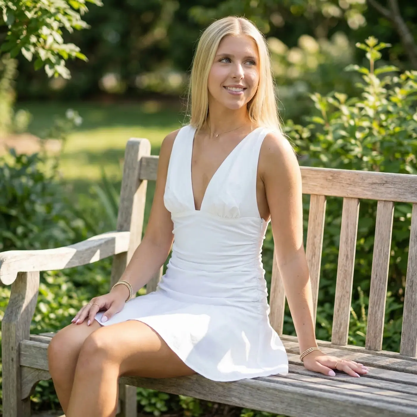 Fashion lifestyle image: white mini dress bench
