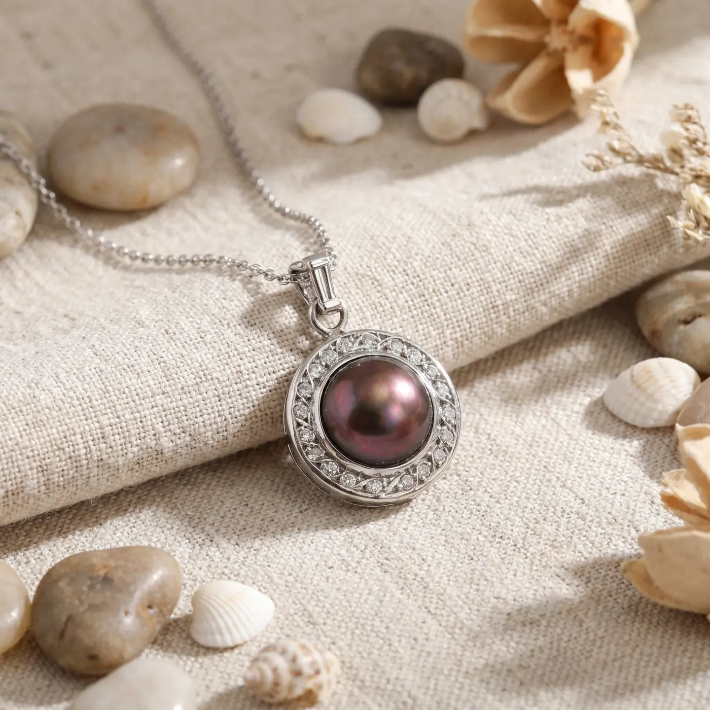 Jewelry lifestyle image: pearl diamond pendant flat lay